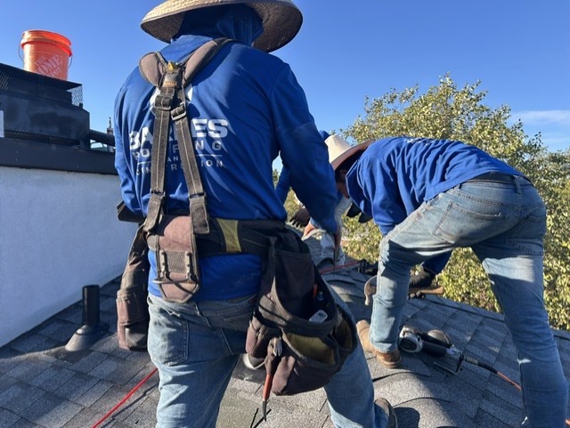 The Barnes crew working on a roof